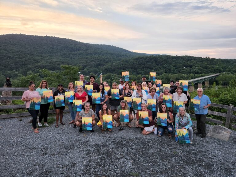 Group of friends posing for a picture with their paintings | Paint Party | Merely Creative, Martinsburg WV